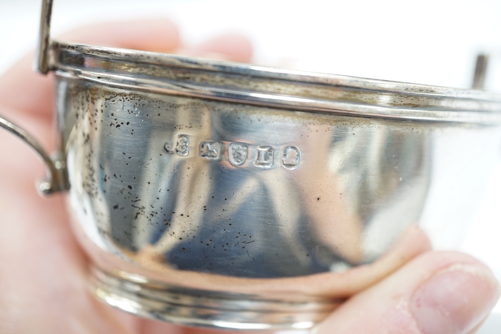 A George III silver two handled oval tub salt by John Eames, London, 1806, 12cm, together with a Georgian silver pap boat (marks rubbed). Condition - poor to fair